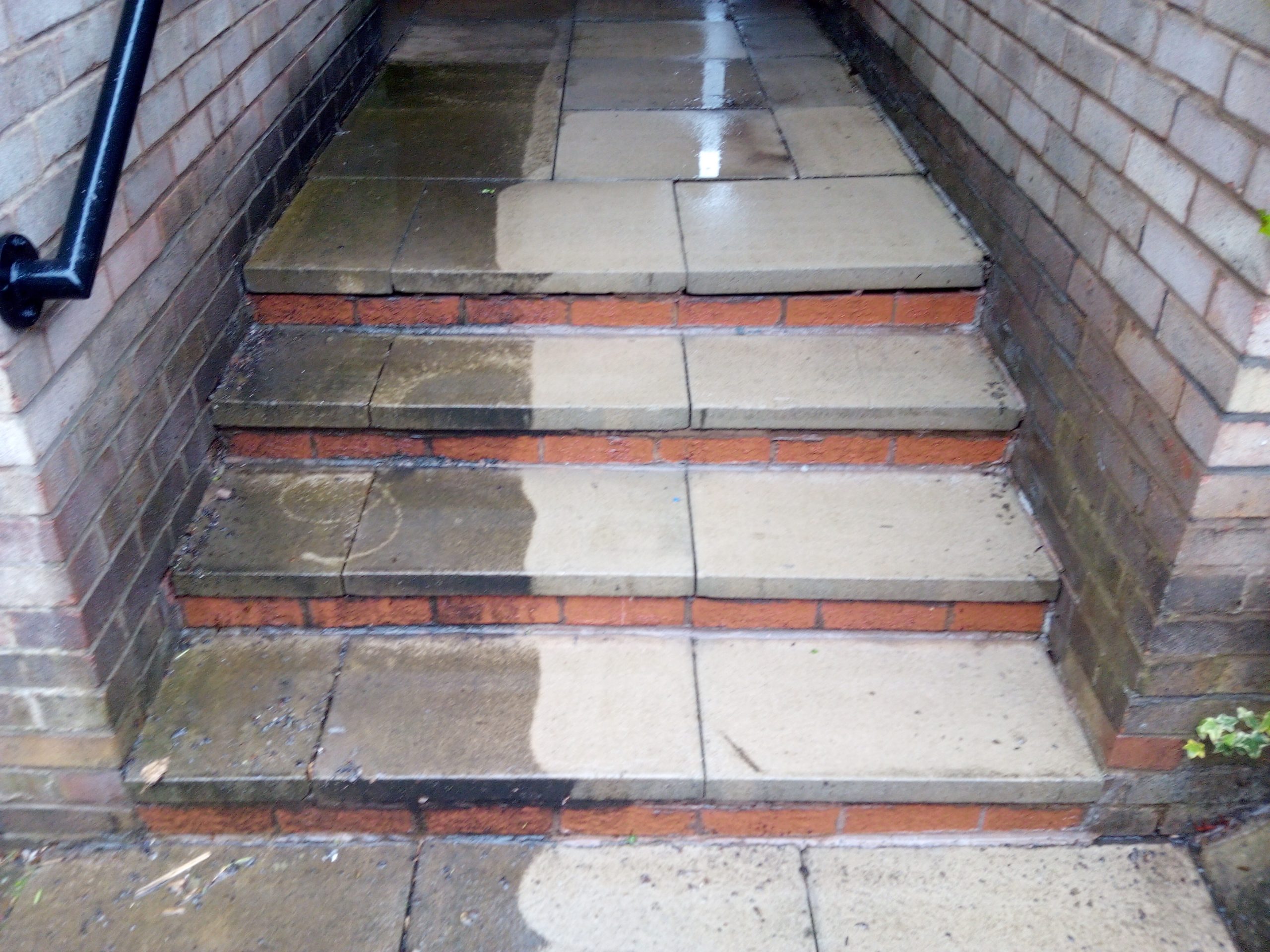 pressure washing on brick staircase