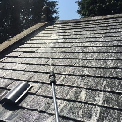 chemical applied on roof for professional roof cleaning process