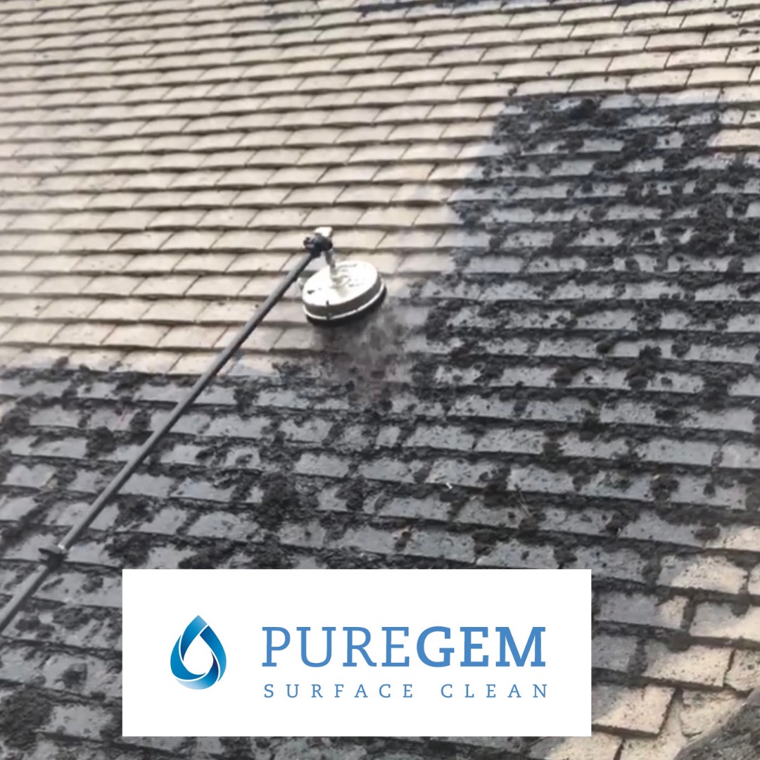 A rotary cleaning attachment removing dense moss from flat-profile roof tiles on a property in Ilkley.